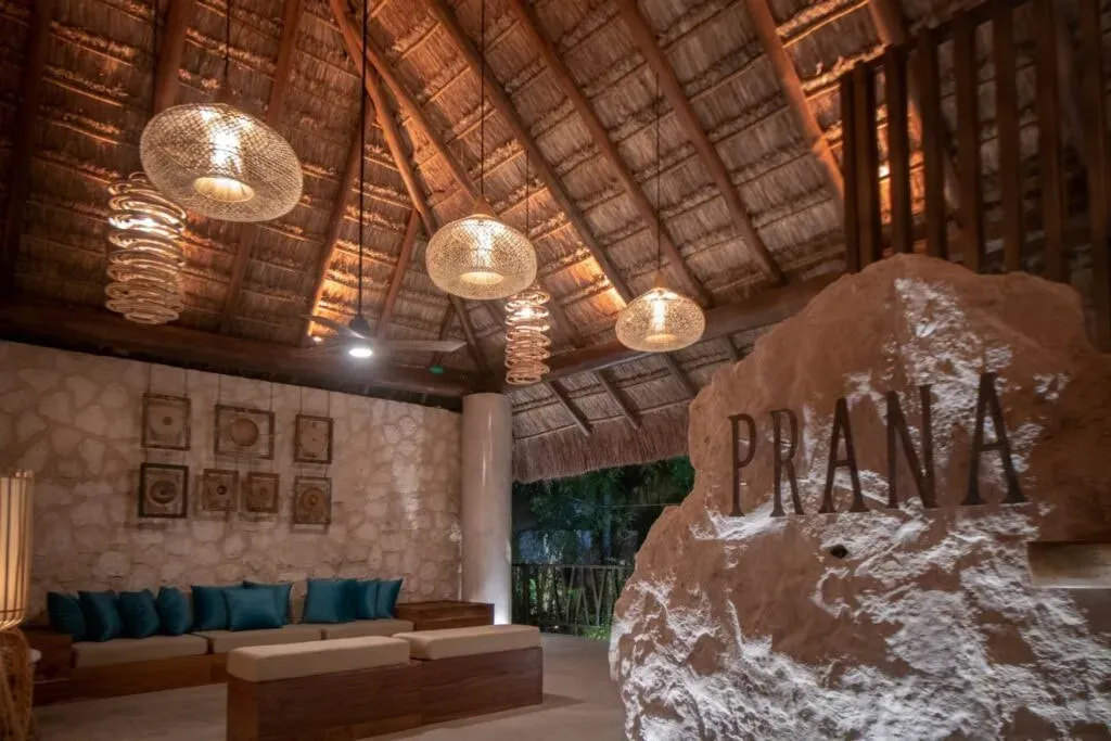 Shambhalla Global — set within the vibrant landscape of Tulum, the Prana Boutique Hotel offers an intimate oasis. Lush gardens, tranquil ambiance, and inviting spaces like hammocks, a pool, and a rooftop create a serene backdrop for personal growth and relaxation, providing a sanctuary amidst the energy of the region.