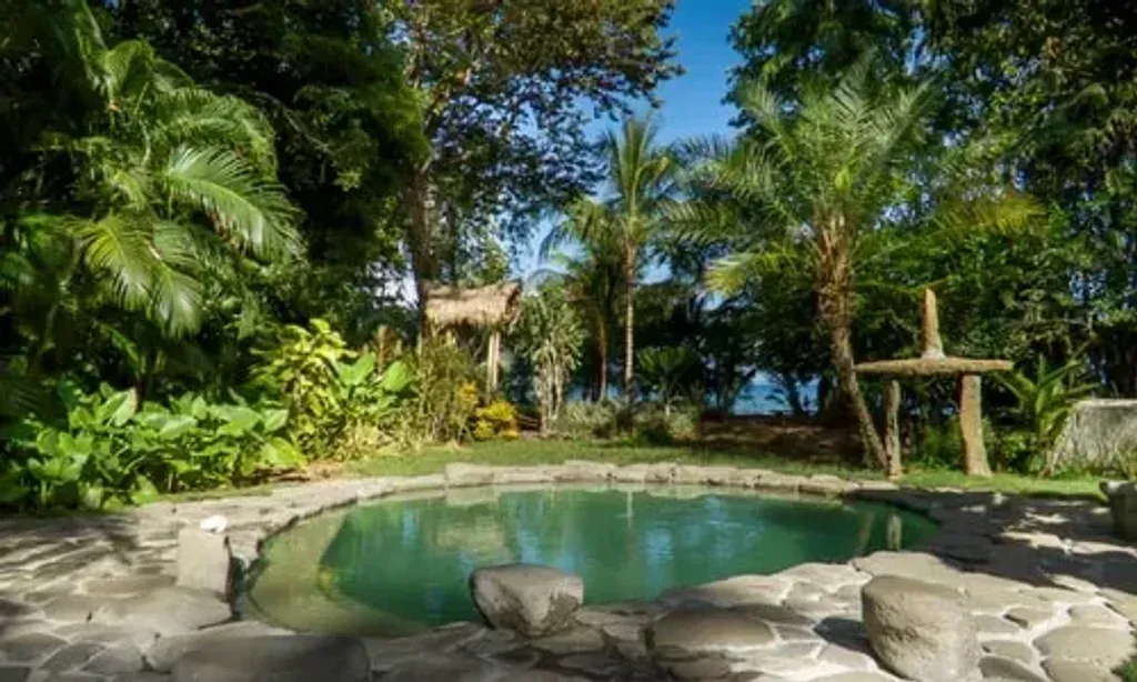 Shanti Wasi — set within the lush forest at the edge of the sea, Ojo del Mar Ecolodge provides a stunning backdrop for Shanti Wasi's retreats. The Osa Peninsula is renowned for its incredible biodiversity, offering a truly immersive natural experience. Structures are thoughtfully integrated into the jungle and along a quiet beach, creating a serene and harmonious environment.