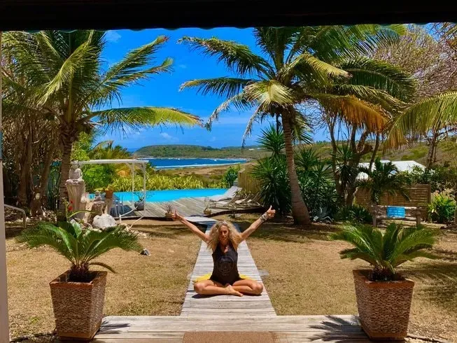 SKYYOGA — The center is situated in a quiet, elevated neighborhood in Trois-Rivières, providing a peaceful environment. From its vantage point on the hills, guests can enjoy scenic views overlooking the beautiful island of Les Saintes, adding to the sense of calm and natural beauty.