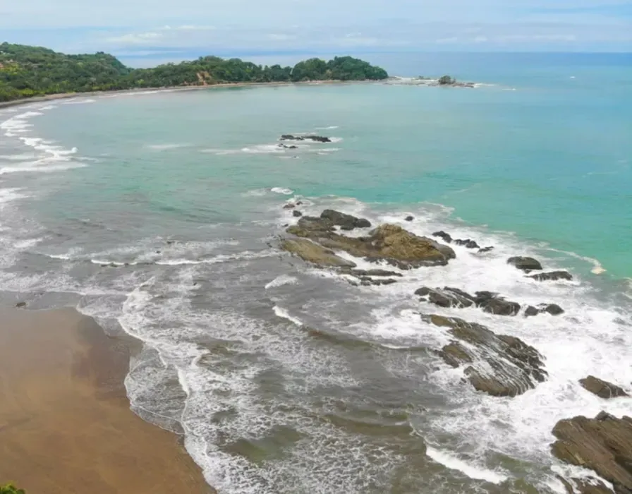 Soma & Soula Women's Embodiment Retreat — Perched 1,300 feet above the Pacific coast in Costa Rica's southern zone, where mountains meet the sea, this retreat offers a refreshing escape. The elevated location provides cooler temperatures and fresh breezes year-round, creating a comfortable and tranquil atmosphere. It's a scenic 15-20 minute drive to Dominical, the nearest beach, allowing for both mountain serenity and easy access to coastal beauty.