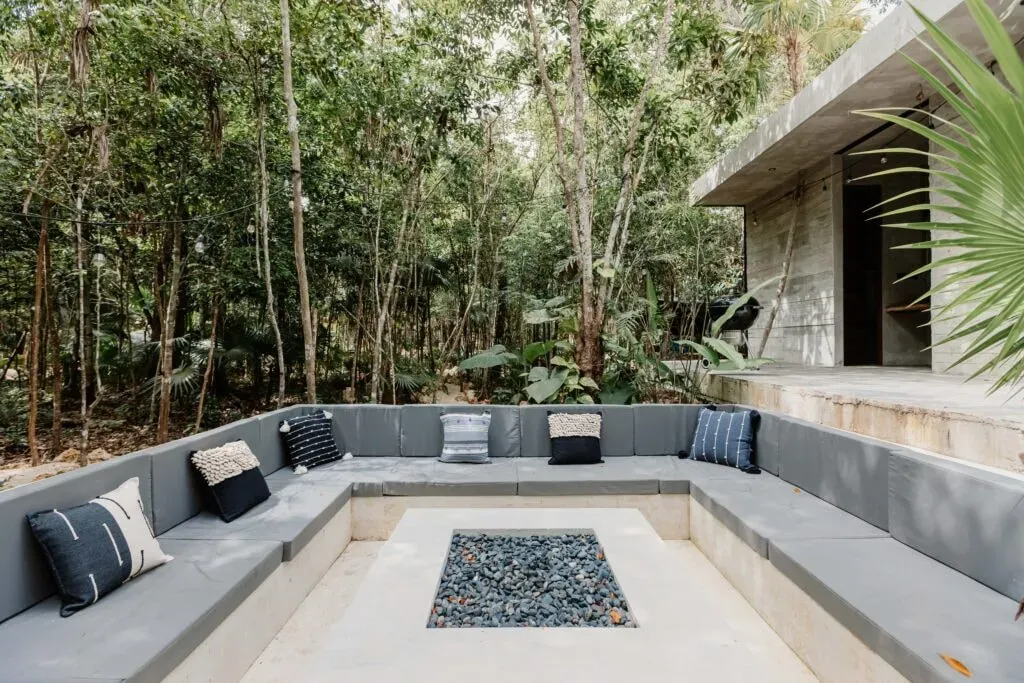SOTA conceptual human space — The center is located on the Ruta de los Cenotes, a lush, jungle-filled area near Puerto Morelos. The venue emphasizes a deep connection with nature, featuring a symbolic heart-shaped cenote hidden amidst the greenery, providing a serene backdrop for meditation and ceremonies.