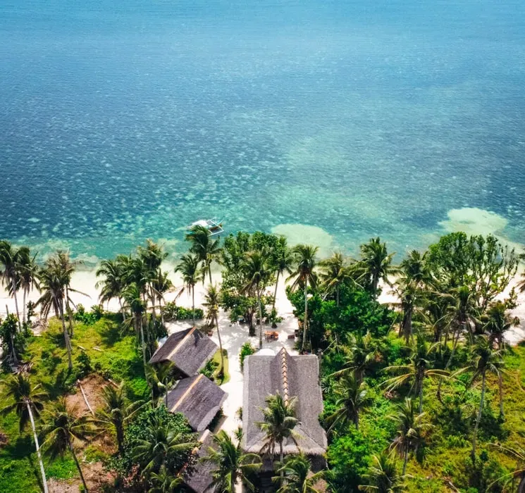 Soultribe Beach Retreat — Soultribe Beach Retreat is situated on a sleepy, palm-tree-lined beach in Malinao, General Luna, on the Philippine island of Siargao. It offers a serene, remote atmosphere well suited to disconnecting, yet is close enough to a variety of activities to keep you engaged and present.