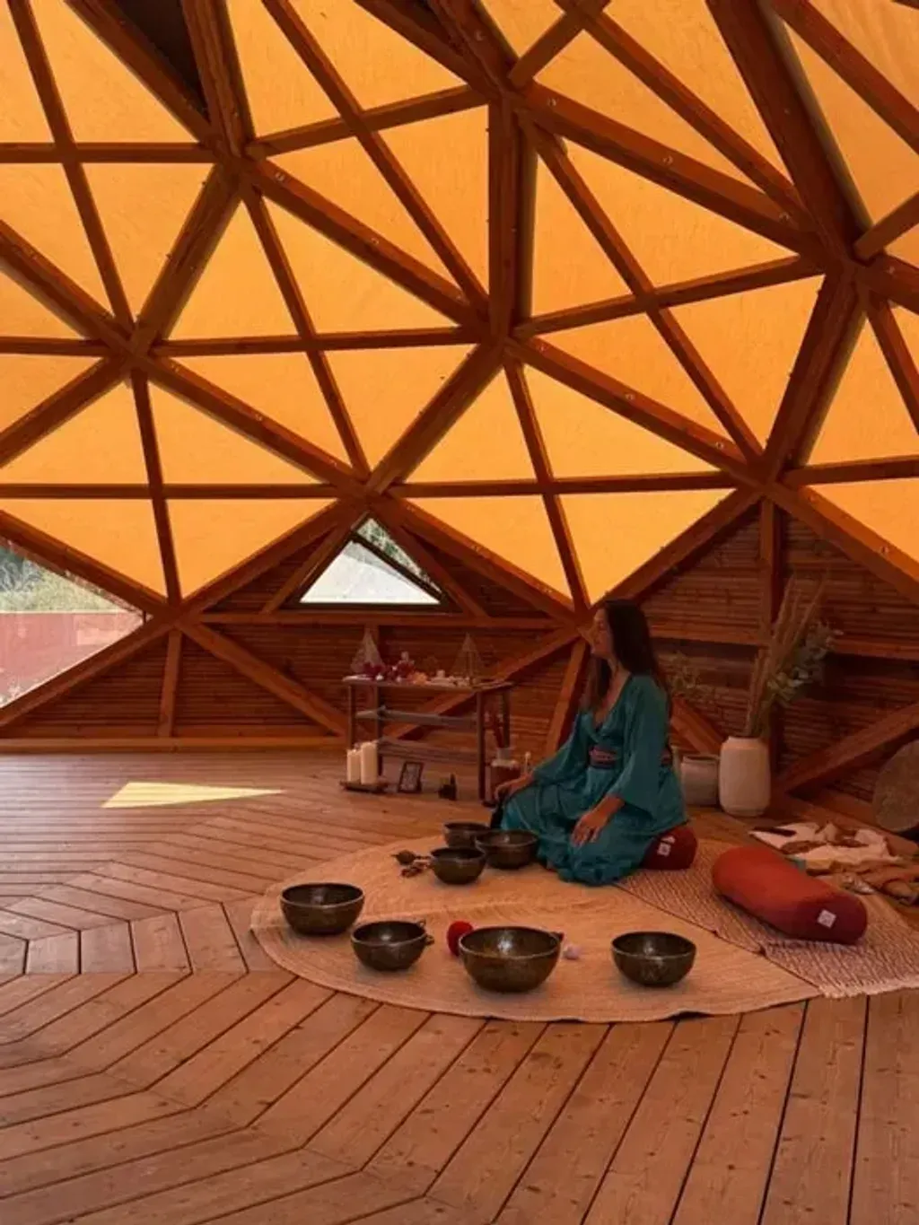 Spathika — Aterra, the venue for Spathika, is an ecological retreat center set in a lush valley, surrounded by verdant forest and tranquil water. The environment is designed for quiet contemplation, with natural materials used throughout the buildings, creating a blend of beauty, simplicity, and grounding. Numerous peaceful spots are scattered across the property, including a freshwater lake with its own beach.