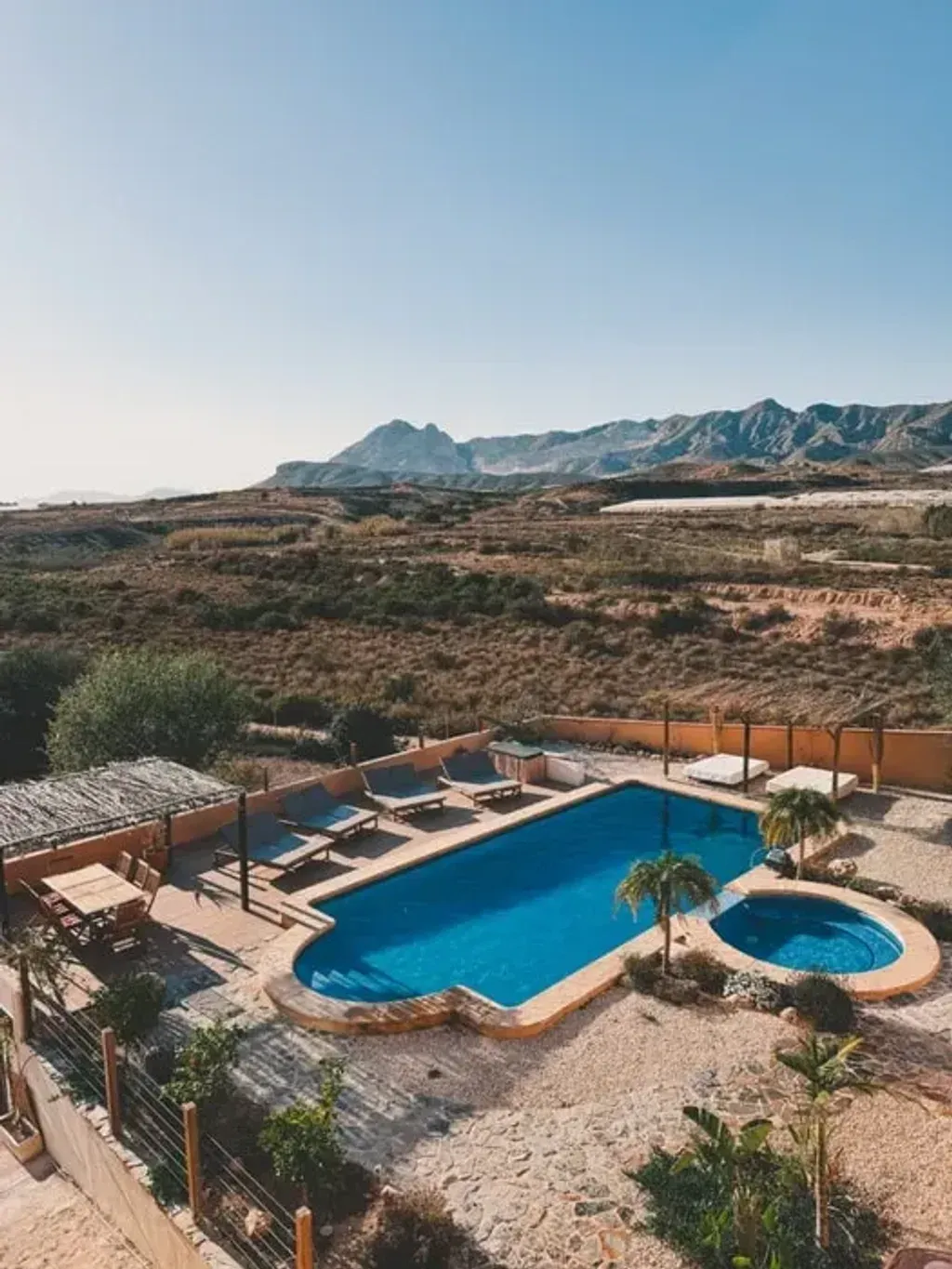 StrongHer Escapes — The retreat is situated in Los Randeros, Alicante, offering a peaceful escape with a quiet garden filled with fruit, olive, and almond trees. While providing a serene environment, it's also conveniently located just 35 minutes from the beautiful beaches of the Costa Blanca, and within reach of larger cities like Orihuela and Murcia for shopping, as well as smaller Spanish towns and markets for a taste of local life.