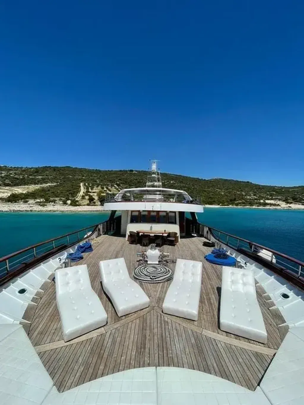 Summer Trip 2025 - Yachts & Yoga — This retreat takes place aboard the Deluxe MS President, a comfortable yacht exploring the stunning coast and islands of Croatia. The vessel itself offers a large indoor restaurant-salon, an outdoor terrace, and a spacious sun deck with a plunge pool and sun-chairs. A platform at the rear provides easy access to the water for swimming.