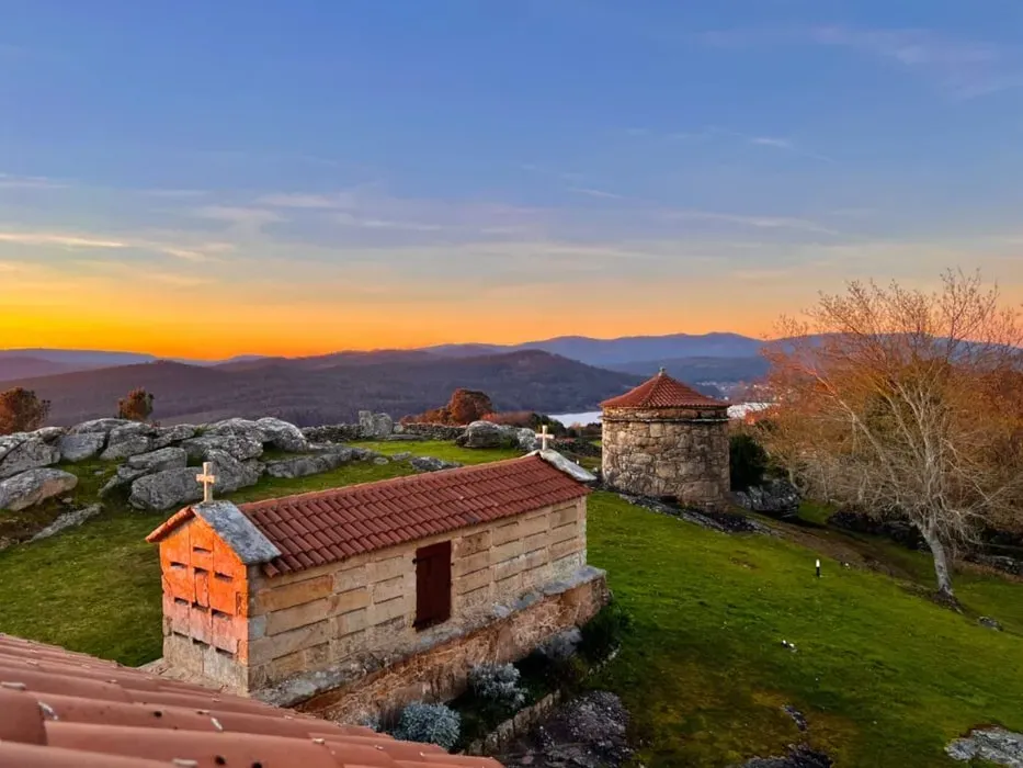 Terranam Retreat Center — Perched on the stunning Galician coast, Terranam Retreat Center is set within a meticulously renovated manor house dating back to 1767. The property is a quiet oasis, cradled between majestic mountains and the expansive sea, offering breathtaking ocean views. Guests can wander through charming grounds that include a historic chapel, a traditional granite horreo, and a refreshing pool, finding peaceful nooks like hammocks set among trees and a serene bamboo cove.