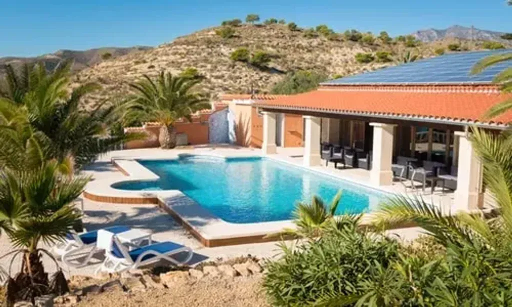 The Balance — The Balance is situated along the picturesque Mediterranean coastline, offering expansive, unique views stretching from Alicante to Benidorm. The villa is surrounded by a large outdoor garden, providing a serene and natural atmosphere for reflection and activities. The overall ambiance is one of tranquility and connection to both nature and ancient traditions.