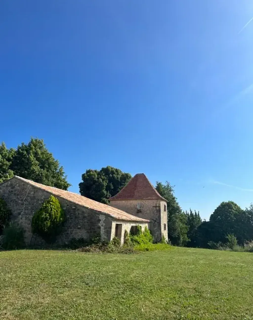 The Barn Retreat — The retreat is set amidst the serene French countryside, surrounded by trees and birdsong, creating an inspiring and tranquil environment. The property features spacious grounds and a landscape designed for contemplation, with a refreshing pool available during the warmer months.