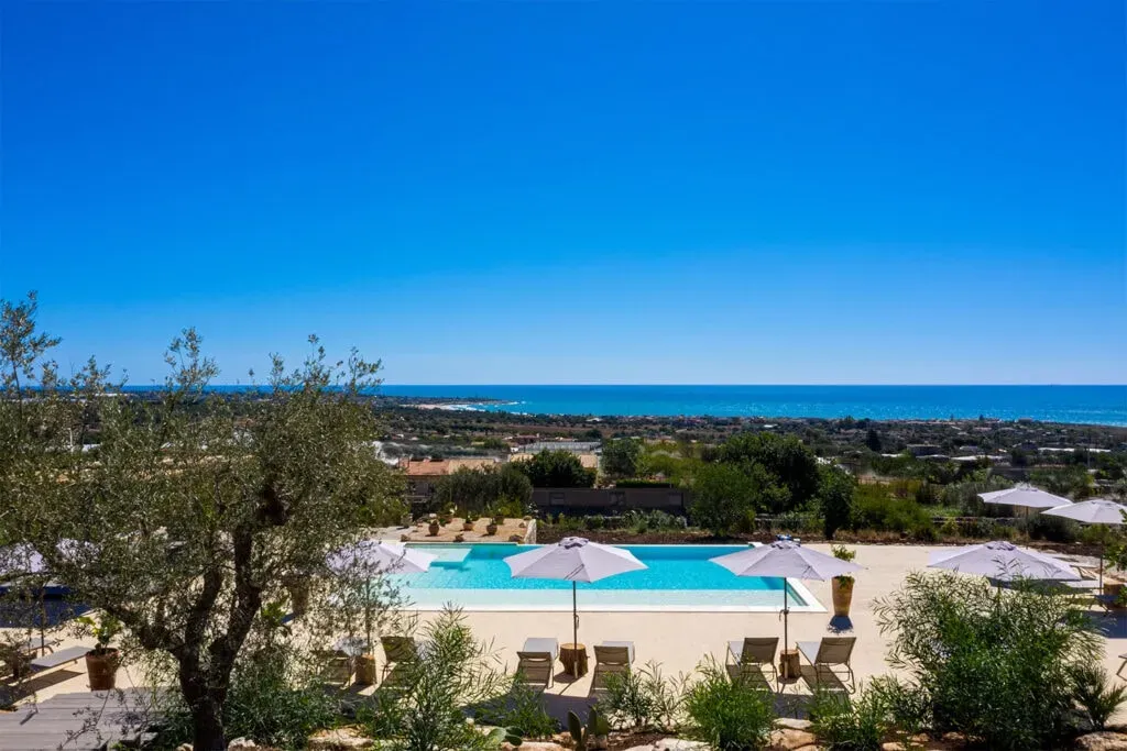The Energy Lab — set between the rolling Sicilian countryside and the sparkling sea, Roccaseta provides a tranquil and rejuvenating escape. The atmosphere blends timeless beauty with modern comfort, offering a serene backdrop for personal growth and energy mastery. It's a place where the natural beauty of Sicily enhances the journey toward deeper connection and sustainable well-being.