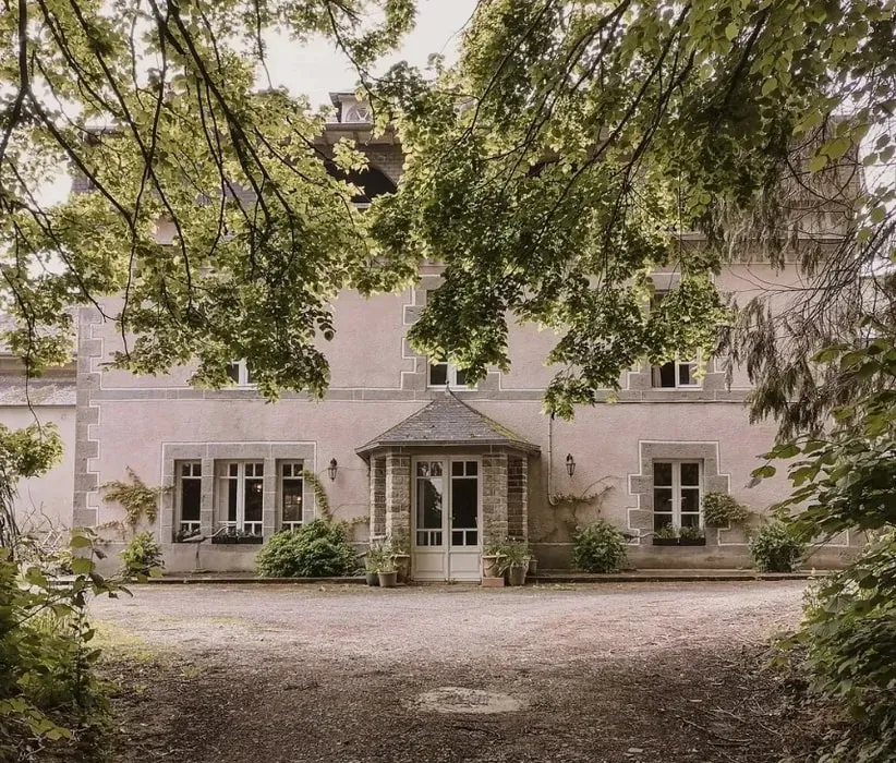 The Gift of Light: Finding Calm, Connection, and Presence — The retreat unfolds within Manoir Caché, a beautifully restored 19th-century stone estate set in the peaceful countryside of Côtes-d’Armor, Brittany, France. Guests are surrounded by lush gardens, expansive meadows, and serene forest views, creating an idyllic and secluded atmosphere.