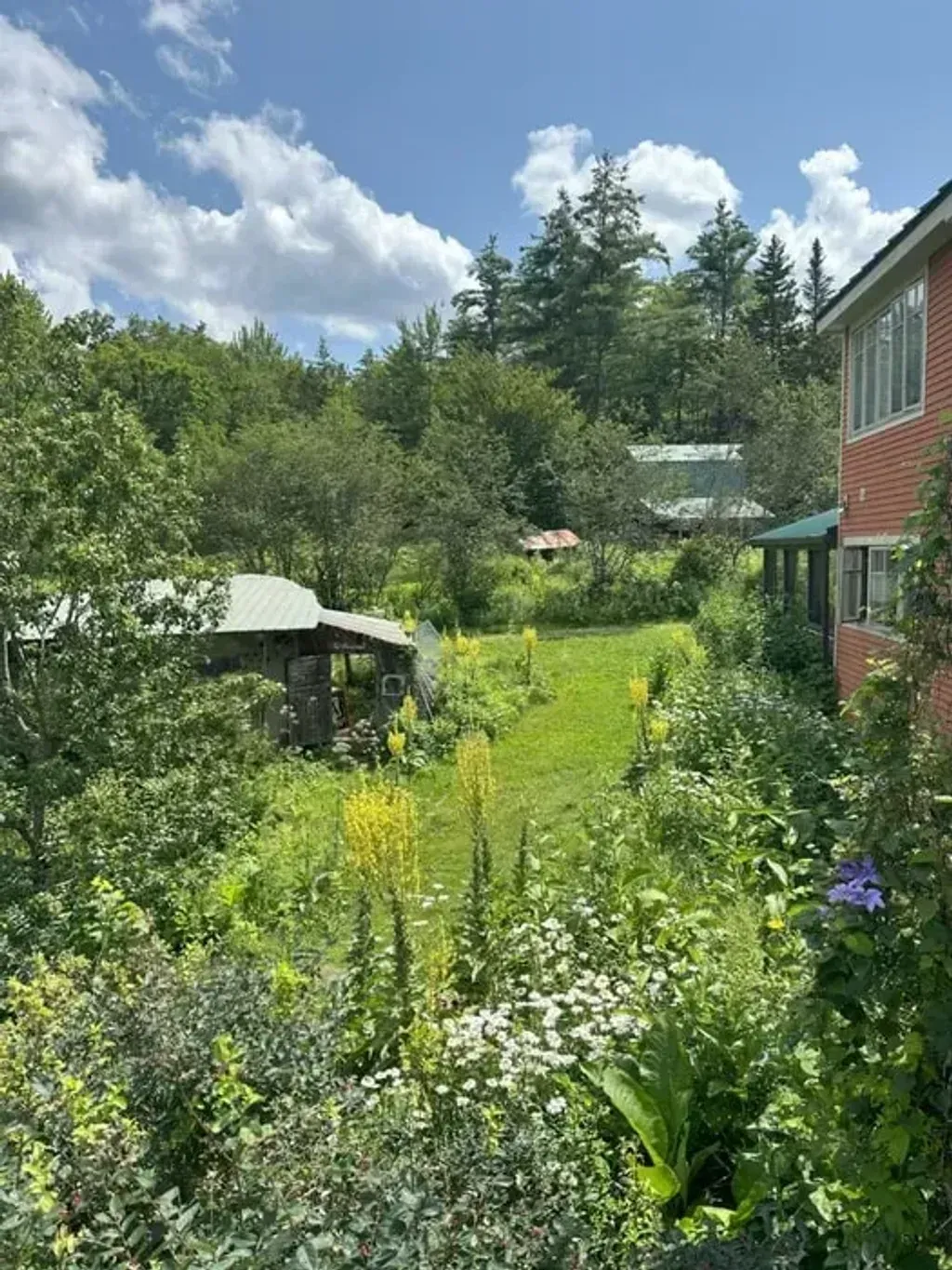 The Hummingbird Center NH — set on multi-generational farmland in Dorchester, New Hampshire, The Hummingbird Center NH is surrounded by a vibrant, edible landscape cultivated through permaculture methods. The rural setting offers a peaceful escape, with opportunities for outdoor recreation and a deep connection to nature. Guests can enjoy the tranquility of the New Hampshire countryside.