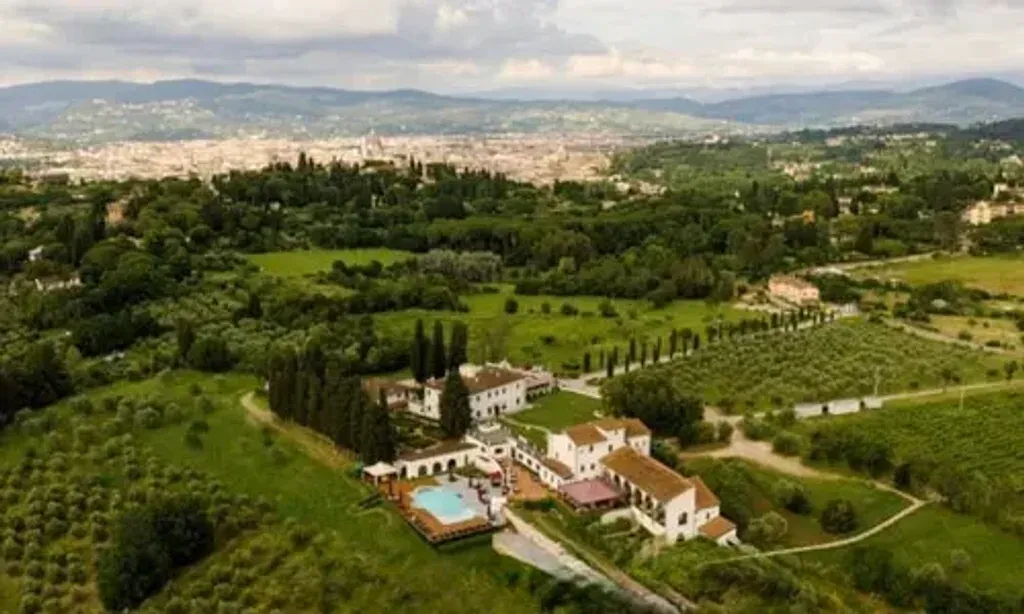 The L36 Project — The L36 Project is situated in the exquisite Villa Tolomei, a traditional Tuscan villa set in the scenic surroundings of Firenze. This luxurious venue boasts a vineyard, a refreshing pool, and elegant dining facilities, all within a short distance of the historic city center, offering a blend of serene natural beauty and cultural accessibility.