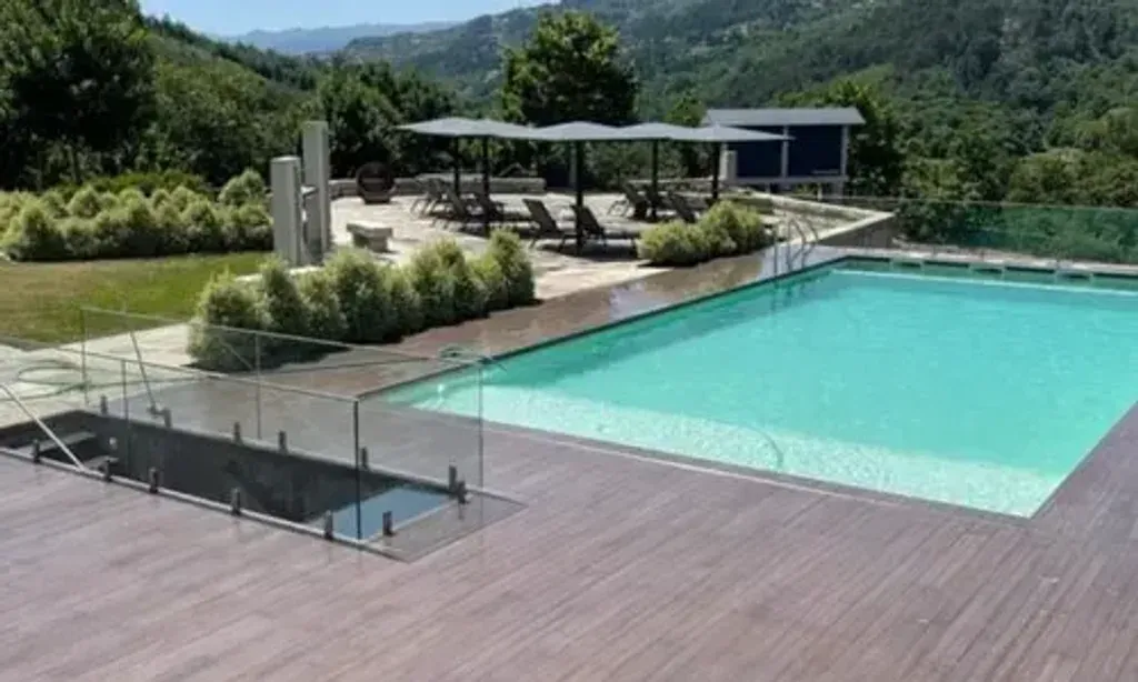 The Miracle Club — The center is situated at Quinta da Eira, a luxurious property in Marco de Canaveses, Porto. It's surrounded by rolling green hills, offering scenic views and a peaceful atmosphere. A spacious garden, swimming pool, and outdoor yoga deck provide ample space for relaxation and practice.