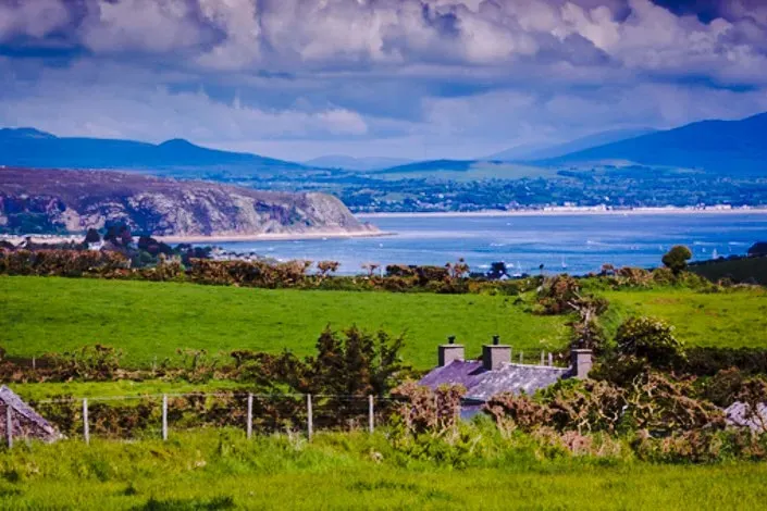 The Retreat Abersoch — The retreat is situated on the Western tip of the beautiful Llyn Peninsula in Gwynedd, North Wales, an Area of Outstanding Natural Beauty. It's a secluded venue surrounded by rolling fields and spectacular views, offering plenty of outdoor space. The location provides easy access to coastal hikes and beaches, while also being a short drive from the lively village of Abersoch.