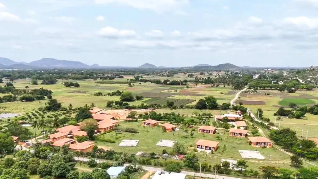 The Sacred Grove and ArogyaM — The center is situated in the tranquil rural landscape of Chittoor, South India. Surrounded by natural farms and offering a peaceful environment, it provides a serene escape from urban life, ideal for quiet contemplation and connecting with the natural world.