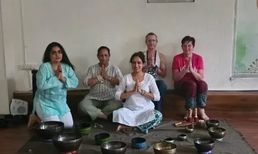 The Yoga Family India — set in Upper Tapovan, Rishikesh, the center offers a peaceful mountain setting. Guests can enjoy comfortable rooms with views of the surrounding peaks, providing a tranquil backdrop for practice and relaxation. Common garden areas invite quiet contemplation.