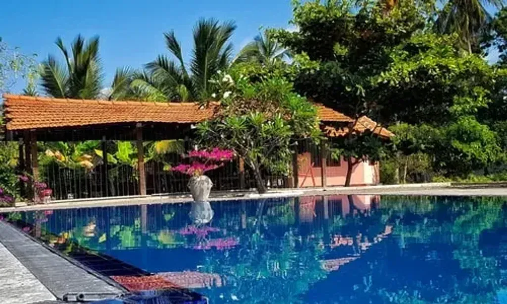 touchedbyinfinity — The center is situated in Trincomalee, Sri Lanka, at the Nilaveli Ayurvedic Retreat. It boasts a beautiful yoga shala overlooking a tranquil lagoon, providing a peaceful backdrop for practice and reflection. The proximity to the turquoise sea allows for refreshing swims and immersion in the tropical environment.