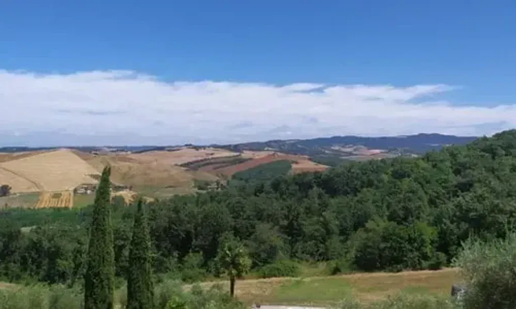 Tuscan Retreat — The retreat unfolds amidst the verdant, picturesque landscape of the Volterra countryside, a quintessential Tuscan setting. The Transmission School provides a serene and inspiring backdrop, fostering an atmosphere of communal living and holistic exploration. Expect rolling hills, lush greenery, and a peaceful environment conducive to introspection and connection with nature.