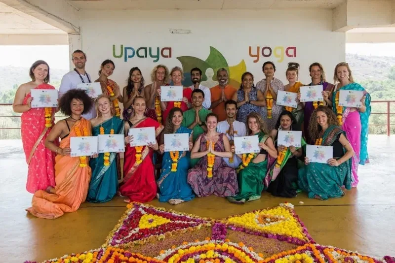 Upaya Yoga Center — set between a river and the beach in Arambol, Goa, the center is surrounded by lush coconut trees. This creates a serene and natural environment for practice, with the sounds and sights of nature enhancing the experience. The area also offers easy access to local markets, shops, and restaurants, providing a blend of tranquility and local vibrancy.