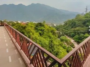 Vinyasa Yoga Academy — The Vinyasa Yoga Academy is set in the peaceful Tapovan neighborhood of Laxman Jhula, Rishikesh. It's surrounded by the lush Himalayan mountains and just minutes from the sacred Ganges River, offering a serene and pollution-free environment ideal for deep practice and study.