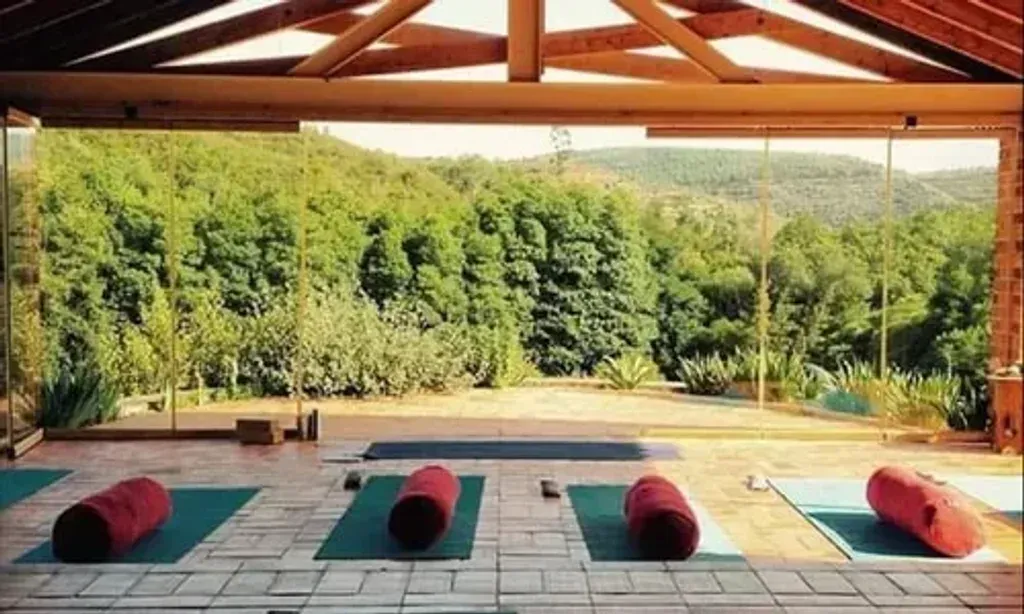 Way of Devotion — set in the breathtaking nature of Orada, S.Teotónio, this retreat center offers a private and expansive environment. The 71-hectare ranch features hiking trails, creeks, and shared spaces like a biopool, meditation temple, and a panoramic solarium, all designed to foster health and transformational moments.
