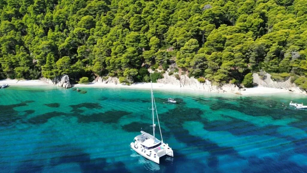 Wellness Flotilla — The retreat unfolds amidst the breathtaking beauty of the Ionian islands, specifically around Lefkas. Guests will experience the serene blue waters, picturesque coastlines, and gentle sea breezes, all from the unique vantage point of a sailing vessel. The atmosphere is one of peaceful exploration and natural harmony.