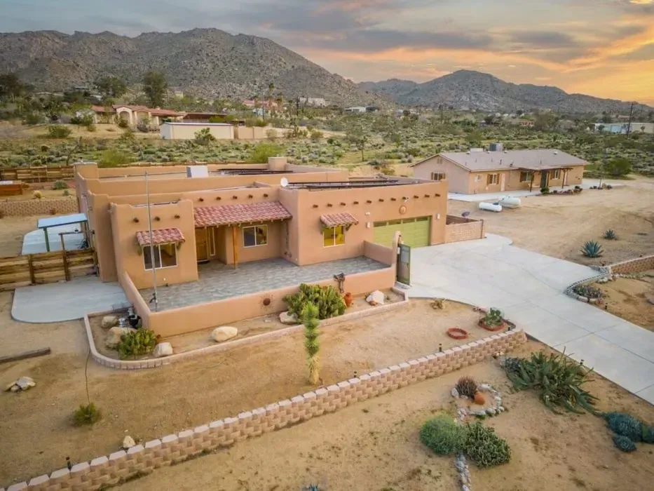 Wisdom In The Wind — set in the iconic Joshua Tree landscape, the Pueblo Del Tierra venue offers a distinctive desert atmosphere. The property spans over 2.5 acres, providing ample space for relaxation and exploration amidst the unique flora and rock formations. The clear desert nights are well suited to stargazing from private hot tubs, creating a tranquil and inspiring environment.