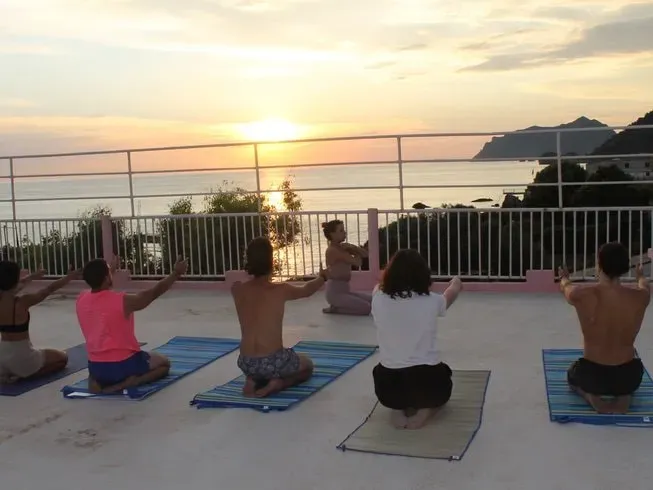 Yoga Corfu Holidays — set on the idyllic southwest coast of Corfu, the center is just a five-minute walk from a picturesque beach. The venue is surrounded by the sights and sounds of nature, offering a tranquil atmosphere with stunning sea views from every room and yoga space.