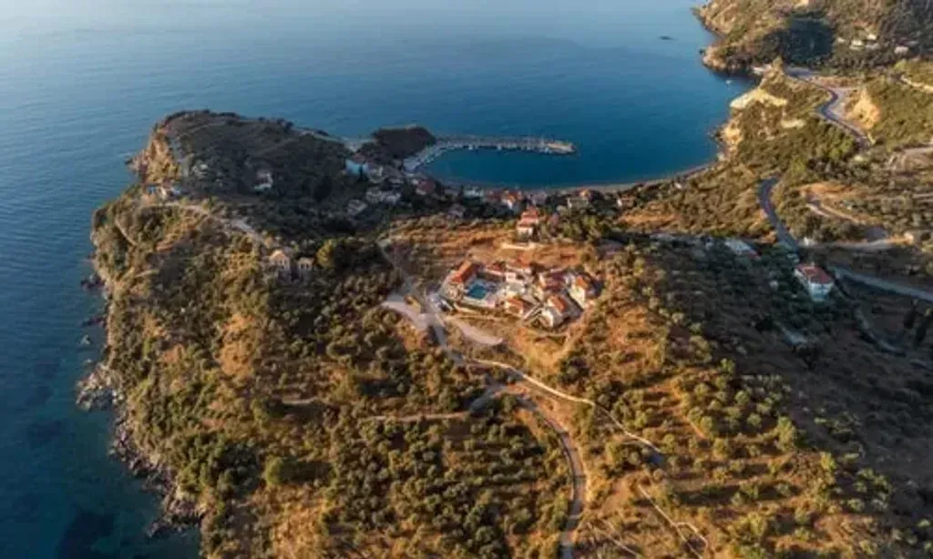 Yoga health mandala — The center is located in Sampatiki, Greece, offering breathtaking views of red rock mountains and the turquoise Aegean Sea. The venue itself is designed to promote relaxation and mindfulness, blending natural beauty with modern comforts to create a peaceful and inspiring atmosphere.