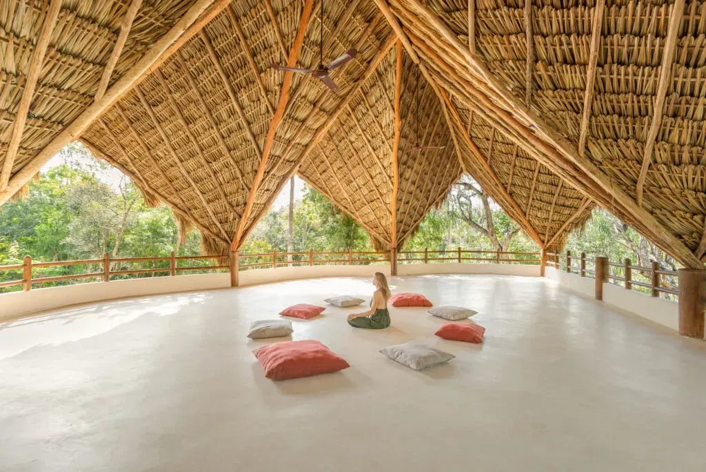 Yoga Pod — set within the vibrant, green jungle of Tulum, Mexico, the Dora Jungle Retreat Center provides a serene and sacred environment. The atmosphere is one of natural tranquility, offering a peaceful escape while still being conveniently close to the lively coastal areas.