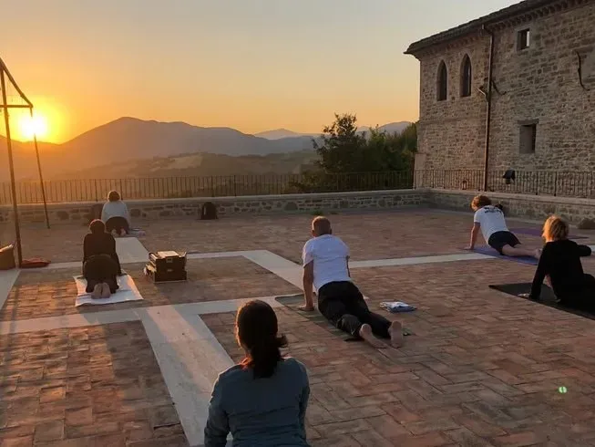 Yoga Stargate — set in the picturesque Umbrian countryside, Yoga Stargate is situated near the historic town of Assisi, Italy. The surrounding landscape is characterized by rolling hills and ancient architecture, offering a peaceful and inspiring environment for reflection and practice. The air is fresh, and the pace of life is slow, inviting a deep sense of calm.