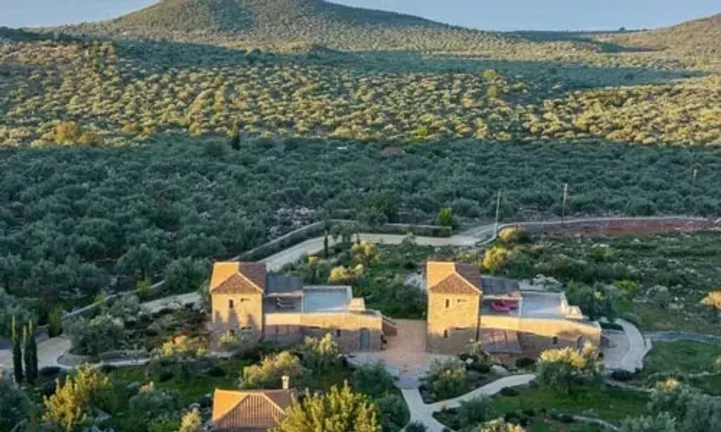 Zen Rocks — Zen Rocks is set against the dramatic backdrop of the Mediterranean Sea, surrounded by endless olive groves. The location in Avia, Greece, offers stunning panoramic views of mountains, sky, and sea, creating a peaceful and inspiring atmosphere. It's a quiet retreat, about 30 minutes south of Kalamata, providing a sense of seclusion and natural beauty.