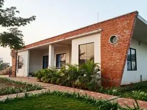 Dhamma Kuti — The center is situated on a spacious five-acre property in Singarbhatha, just outside Raipur. This rural setting provides a calm and quiet atmosphere, ideal for focused meditation practice away from the distractions of city life. The environment is designed to support introspection and peace.